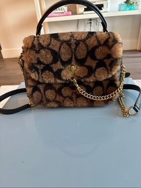 Coach Brown and Black Shearling and Leather Signature bag with Gold Hardware.